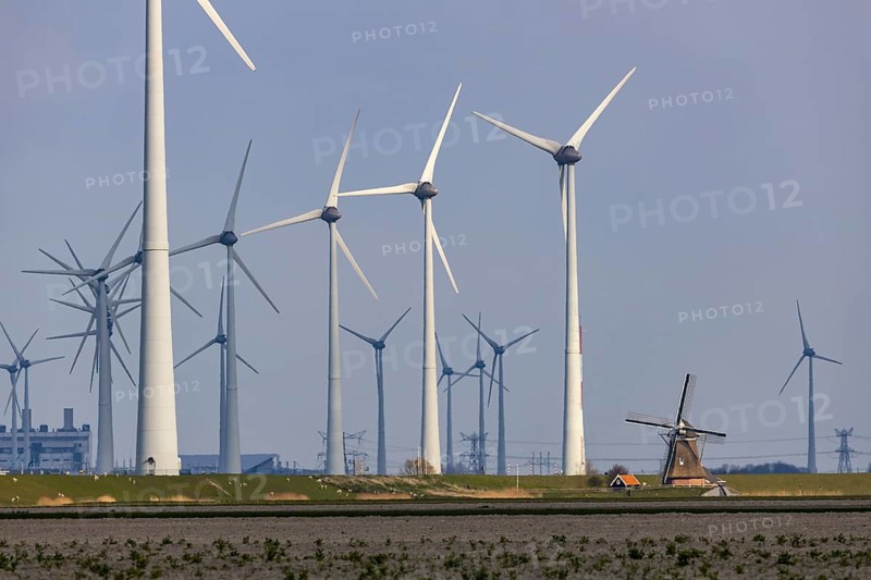 Westereems and Growind wind farms, over 80 wind turbines in total, at the Eemshaven seaport, province of Groningen, in the north-west of the Netherlands, historic Goliath windmill from 1897