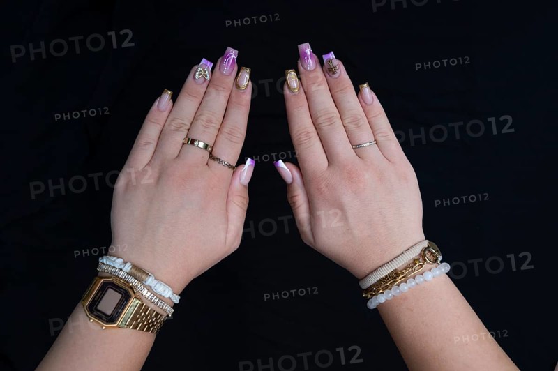 Colourful fingernails of a young woman, on a black background, Baden-Württemberg, Germany, Europe