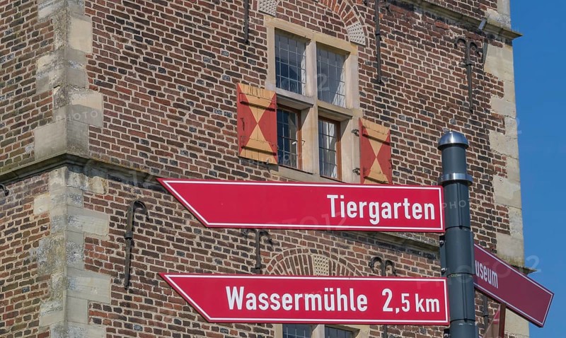 Signpost at Raesfeld moated castle, Münsterland, North Rhine-Westphalia, Germany, Europe