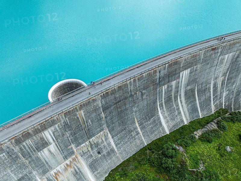 Dam of the Moiry lake, Lac de Moiry, turquoise glacial water, water overflow, tourists, aerial view, Valais, Switzerland, Europe