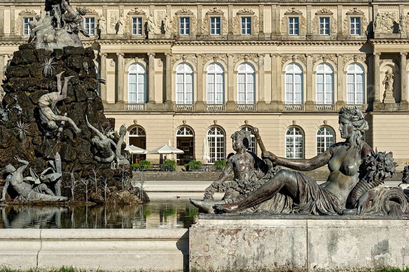 Mythological female figure at the edge of the Fama Fountain, Fama Fountain, fountain, fountain, water parterre, New Herrenchiemsee Palace, palace park, Herreninsel, Chiemsee, Chiemgau, Upper Bavaria, Bavaria, Germany, Europe