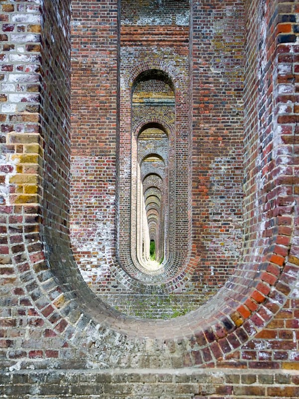 Pattern of brick arches in the railway viaduct opened in 1849, Chappel, Essex, England, United Kingdom, Europe