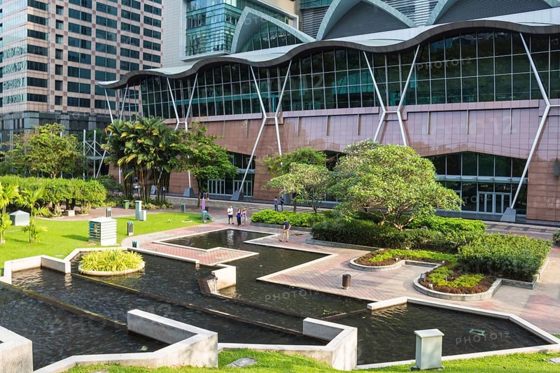 Modern building with a small garden and cascade pond