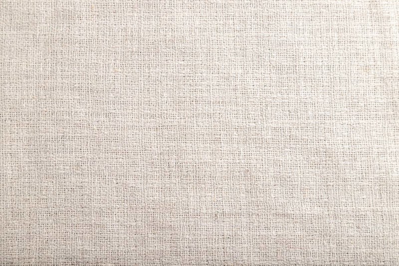 Fragment of smooth white linen tissue. Top view, flat lay, natural textile background and texture