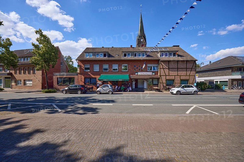 Weseler Strasse with buildings and St. Pankratius church in the Buldern district, Dülmen, Münsterland, Coesfeld district, North Rhine-Westphalia, Germany, Europe