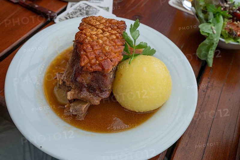 Schäufele with dumpling and salad served in a beer garden, Franconia, Bavaria, Germany, Europe