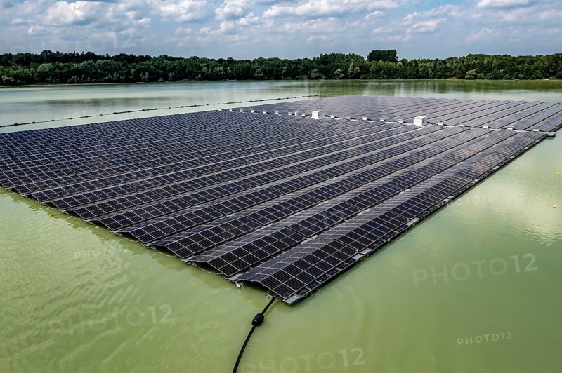 Germany's largest floating solar power plant on the Silbersee III, a quarry pond no longer used for sand mining, near Haltern am See, operated by Quarzwerke GmbH, around 5800 solar modules, on an area of a good 2 football pitches, generate 3.1 megawatts of power, the company uses the electricity itself on weekdays, at weekends it flows into the public grid, North Rhine-Westphalia, Germany, Europe