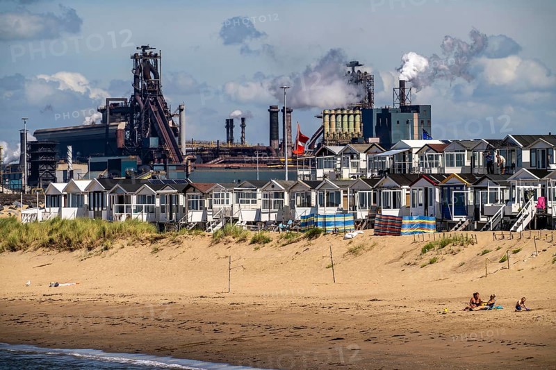 The Tata Steel steel and smelting works in IJmuiden, Velsen, North Holland, Netherlands, largest industrial area in the Netherlands, 2 blast furnaces, 2 coking plants, rolling mills, directly on the North Sea, beach houses near Ijmuiden aan Zee