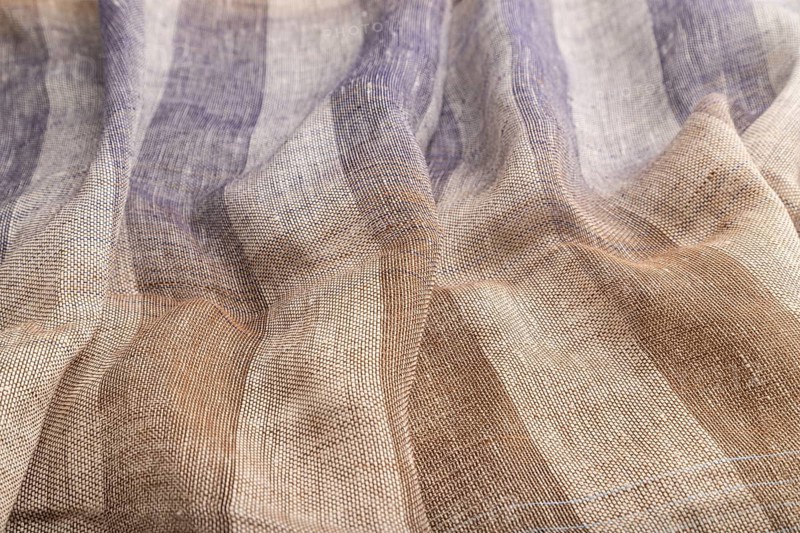 Fragment of brown and violet linen tissue. Side view, natural textile background and texture. wave concept, abstract