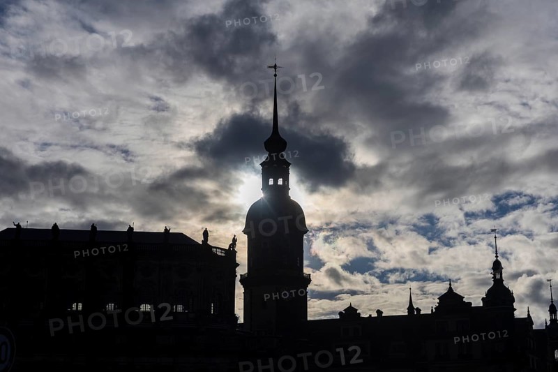 Rainy weather in Dresden's old town. The steep winter sun emphasises the silhouettes of the historic buildings Residenzschloss with Hausmannsturm and Hofkirche, Dresden, Saxony, Germany, Europe