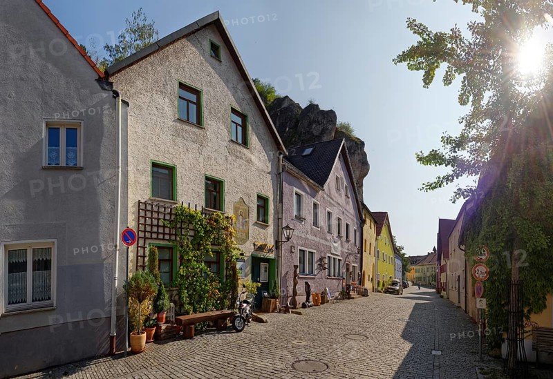 Sunlit Vils alley with historic buildings and plant decoration, Kallmünz, Upper Palatinate, Bavaria, Germany, Europe