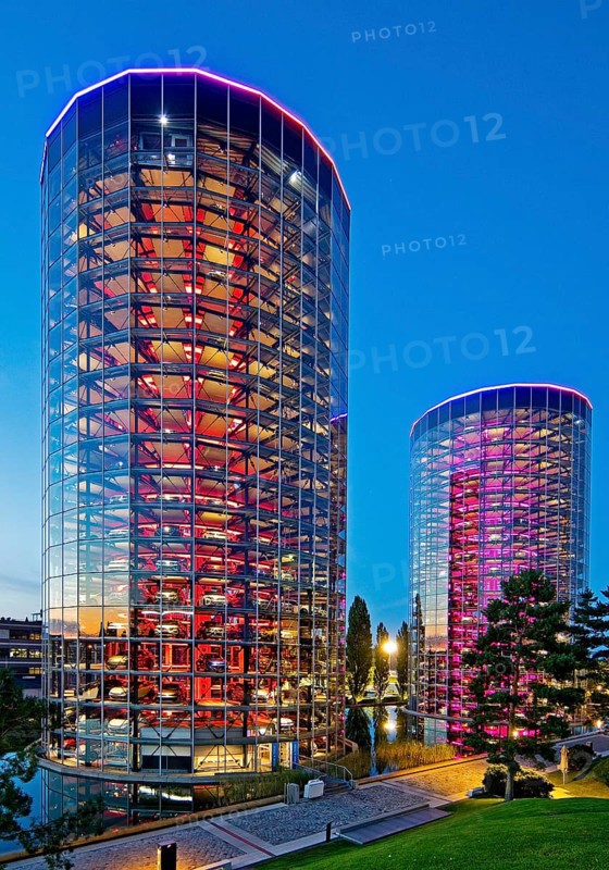 The illuminated car towers with new cars for delivery in the evening, Autostadt, Volkswagen AG, Wolfsburg, Lower Saxony, Germany, Europe