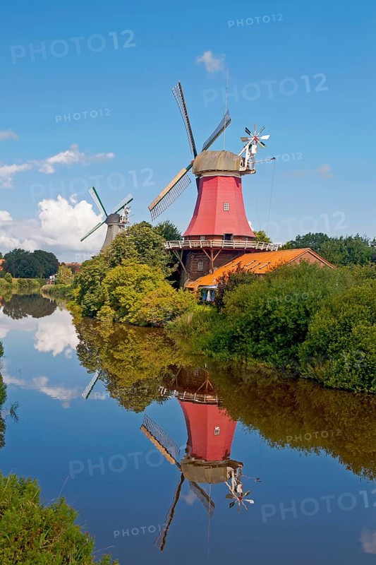Twin mills Greetsiel at the old Greetsieler Sieltief, Krummhörn-Greetsiel. East Frisia, Lower Saxony, Germany, Europe
