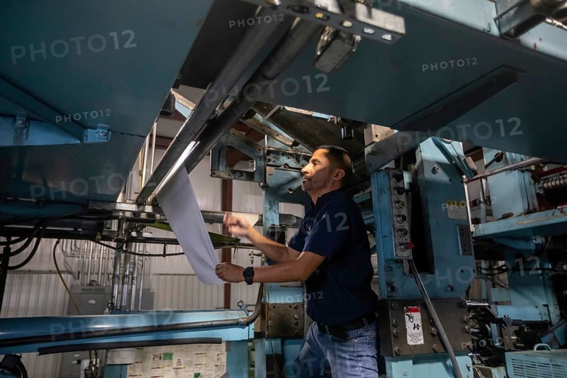 Liberal, Kansas, Danny Moura sets up the printing press at the Leader & Times. Besides its own paper, the company prints weekly community newspapers for publishers in Kansas, Colorado, Texas, and Oklahoma, helping to keep local journalism alive. Across the country, more than 2, 000 local newspapers have closed in recent years