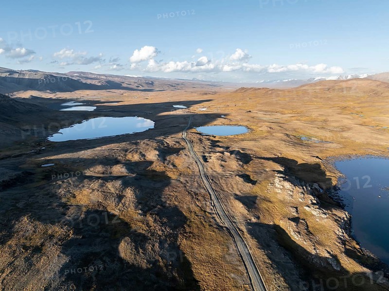 Aerial view, mountain peak and mountain lake, evening mood, Issyk Kul province, Kyrgyzstan, Asia