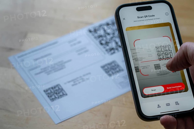 Symbolic image of an e-prescription, prescription issued by a doctor, with QR code, is scanned using a mobile phone and a special app, the code is then shown in the pharmacy and the prescription, which is stored on an IT server, can be retrieved there in conjunction with the health card