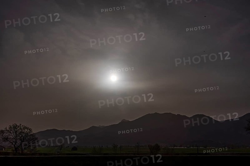 Sahara dust covers the sun in front of a mountain landscape, spring, Loisach-Lake Kochel-Moore, Bavaria, Germany, Europe