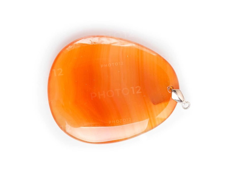 Orange onyx pendant isolated on white background, close up