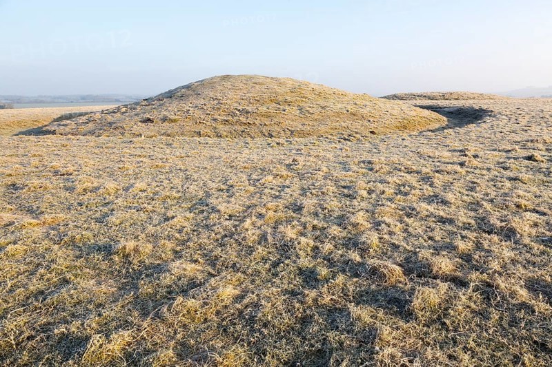 Bronze Age bowl barrow on Windmill Hill, a Neolithic causewayed enclosure, near Avebury, Wiltshire, England, UK