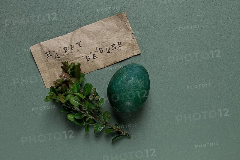 Easter card, green egg, boxwood branch, typewritten text, happy easter