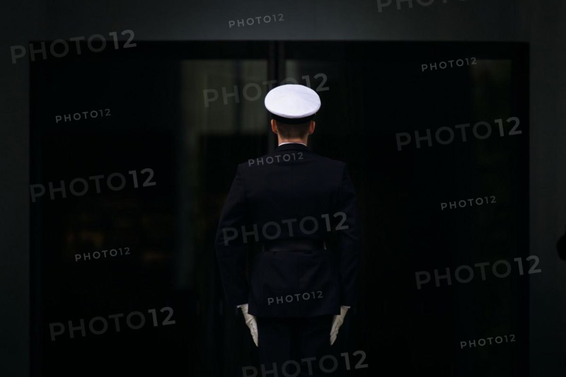 A marine stands with his back to the camera in front of the entrance to the Federal Chancellery. Berlin, 24.04.2024