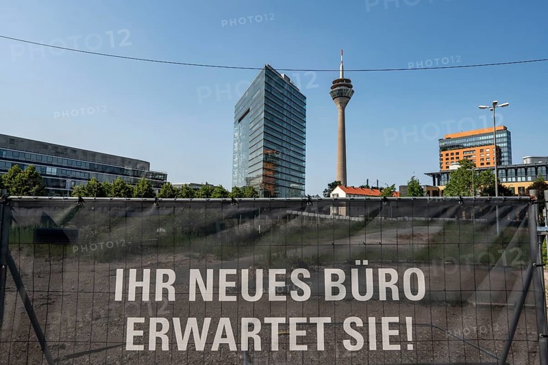 Construction project Pandion Rise, office building and Pandion Next, residential building, in the city centre of Düsseldorf, construction fence, advertising for the real estate project, excavation pit, city gate building, North Rhine-Westphalia, Germany, Europe