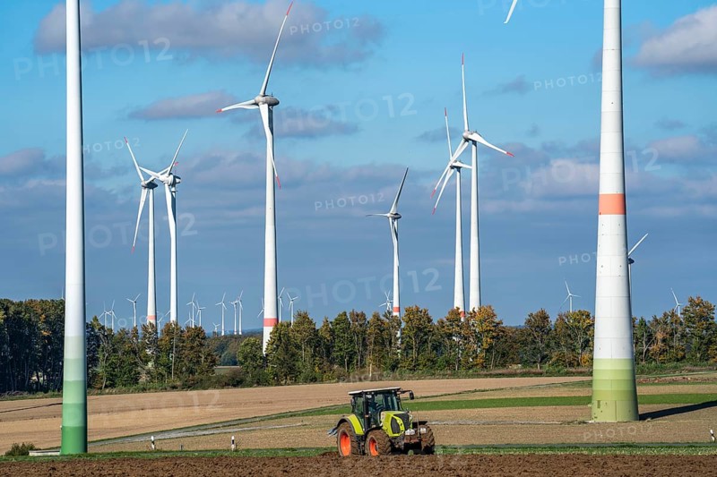 Farmer working in the fields, with a tractor, wind farm above the village of Lichtenau, self-proclaimed energy town, Paderborn district, OWL, A North Rhine-Westphalia, Germany, Europe