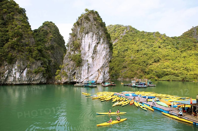 Yellow kayaks at a jetty and the karst rocks in Lan Ha Bay, Halong Bay, Vietnam, Asia