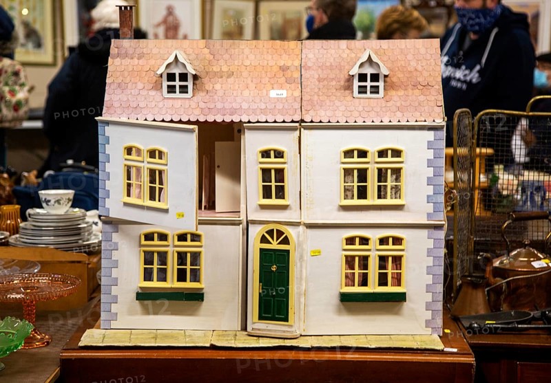 Wooden dolls house on sale at an auction room, UK