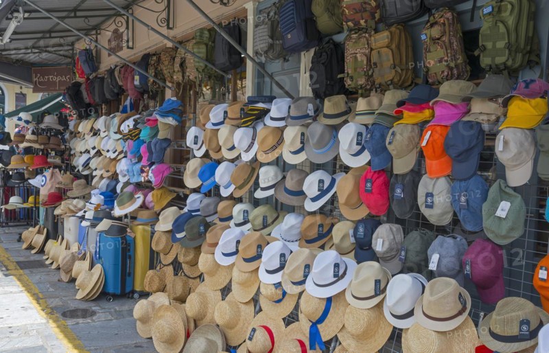 Market stall with a large selection of hats of different colours and shapes, Kalamata, Messinia, Peloponnese, Greece, Europe