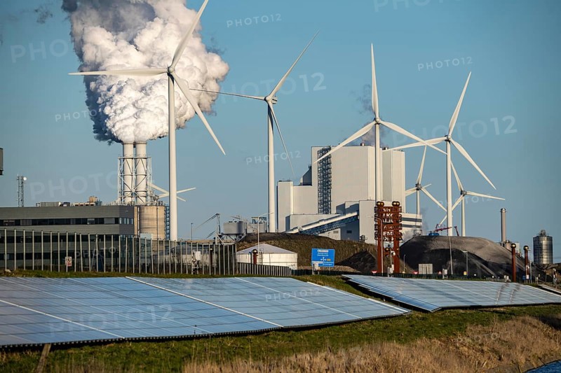 Solar park on the Slaperdijk dyke near the Eemshaven, test project, 17, 000 solar modules were installed over a good 5 kilometres, the Netherlands has over 22, 000 kilometres of dyke line, here it is being tested whether such an installation is successful and can be expanded, wind farm, behind the RWE coal-fired power plant Eemshavencentrale Groningen, Netherlands