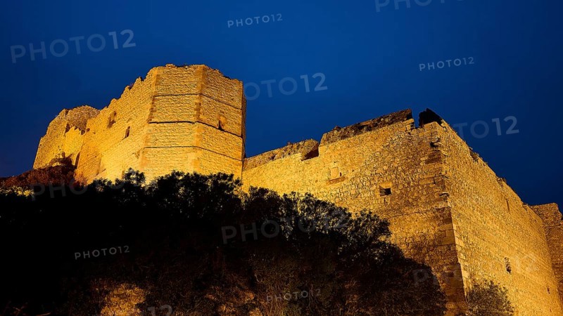 Night shot, view of a castle ruin illuminated at night, surrounded by dark nature and rocky terrain, Kritinia Castle, St John's Castle, Kritinia, Rhodes, Dodecanese, Greek Islands, Greece, Europe
