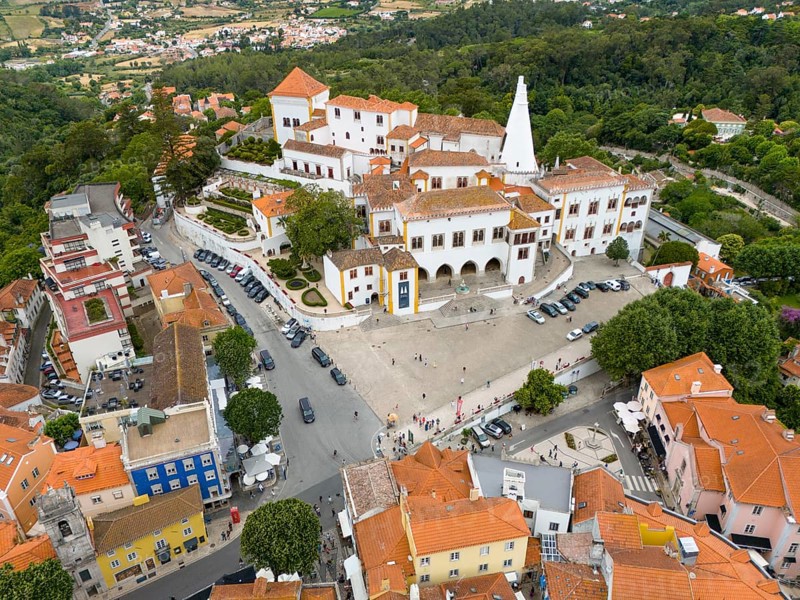View from above of an idyllic town with many white and colourful roofs, surrounded by trees and hills, aerial view, Royal Palace, Palácio Nacional de Sintra, National Palace, Sintra, Lisbon, Portugal, Europe