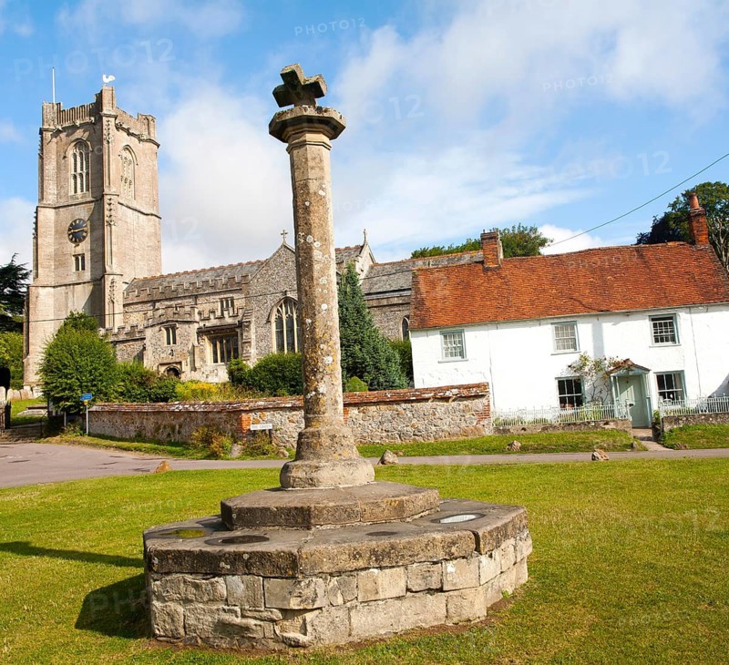 Church of St Michael and butter cross on the village green in Aldbourne, Wiltshire, England, United Kingdom, Europe