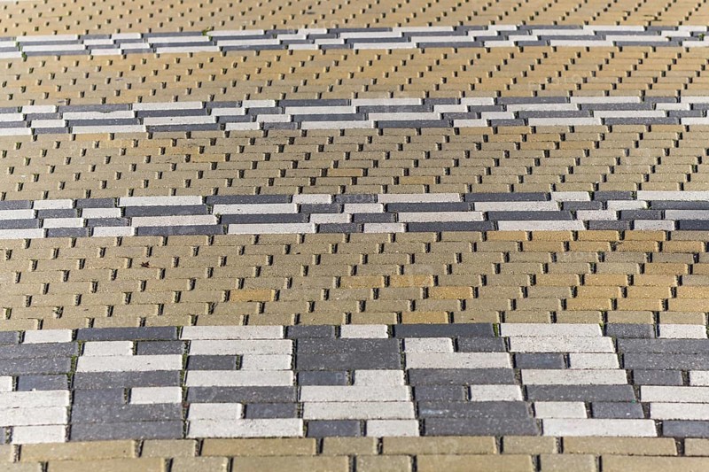 Striped pattern of rectangular tiles in the park