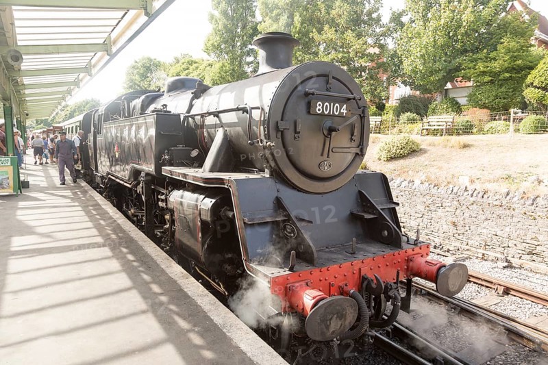 BR Standard Class 4 80104 steam locomotive train engine at platform of railway station, Swanage, Dorset, England, UK