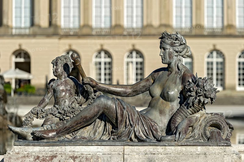 Mythological female figure at the edge of the Fama Fountain, Fama Fountain, fountain, fountain, water parterre, New Herrenchiemsee Palace, palace park, Herreninsel, Chiemsee, Chiemgau, Upper Bavaria, Bavaria, Germany, Europe