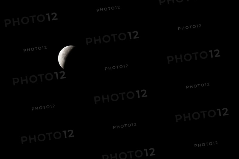 The moon with a partial lunar eclipse, taken in the Swiss mountains, Switzerland, Europe