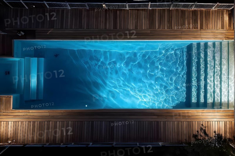 AI generated aerial view perpendicular top down of an wooden deck with a swimming pool at night