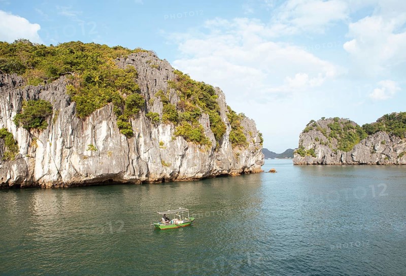Fishing boat and the karst rocks in Lan Ha Bay, Halong Bay, Vietnam, Asia