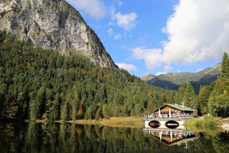 The picturesque Pflegersee lake near Garmisch, with the mountain inn in the background