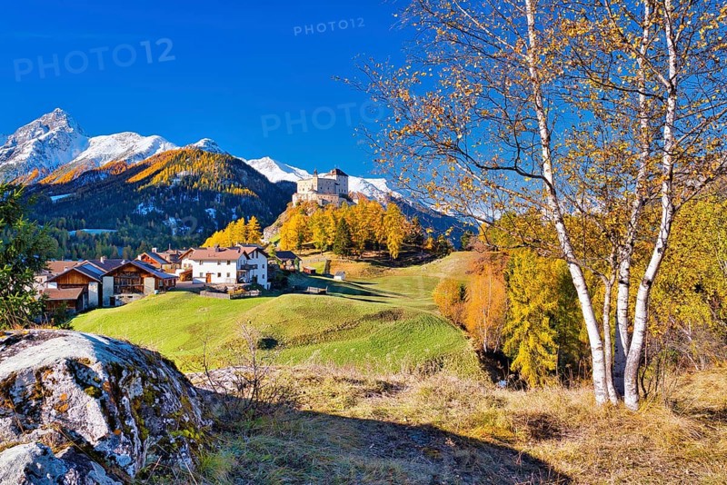 Village view of Tarasp with castle in autumn, Scuol, Canton Graubünden, Switzerland, Europe