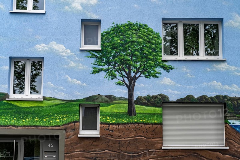 Residential buildings on Feldsieper Straße in Bochum, after an energy-efficient refurbishment, with facade insulation, the Bochumer Wohnstätten Wohnungsgenossenschaft had the buildings painted with a large mural by Dortmund graffiti artist Denis Klatt, it shows a bluethroat and a landscape with trees, life below ground and lots of sky on the entire facade, Bochum-Hamme, North Rhine-Westphalia, Germany, Europe