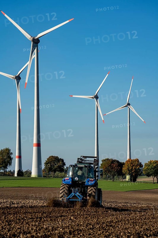 Farmer working in the fields, with a tractor, wind farm above the village of Lichtenau, self-proclaimed energy town, Paderborn district, OWL, A North Rhine-Westphalia, Germany, Europe