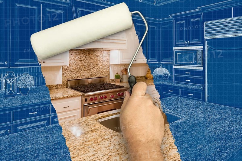 Before and after of man painting roller to reveal custom kitchen photograph under blueprint sketch drawing plans