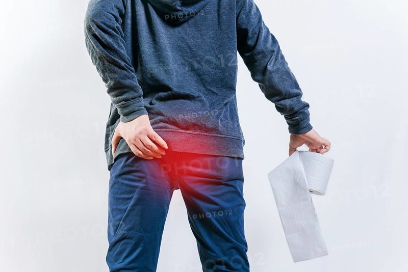 People with diarrhea problems, holding bathroom toilet paper isolated. Concept of person with diarhea holding toilet paper