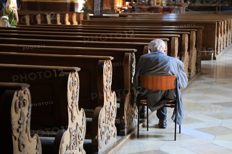 Old grey-haired man as the only churchgoer, interior of the Cistercian Abbey Church Fürstenfeld in Fürstenfeldbruck, Upper Bavaria, Bavaria, Germany, Europe