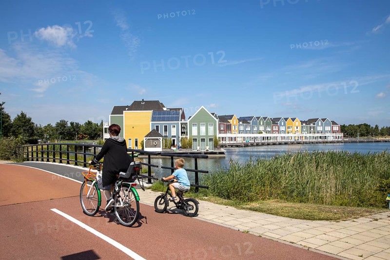 Small town of Houten near Utrecht, bicycles have priority in the town of 50, 000 inhabitants, generous cycle paths, many leisure areas, water areas, living by the water