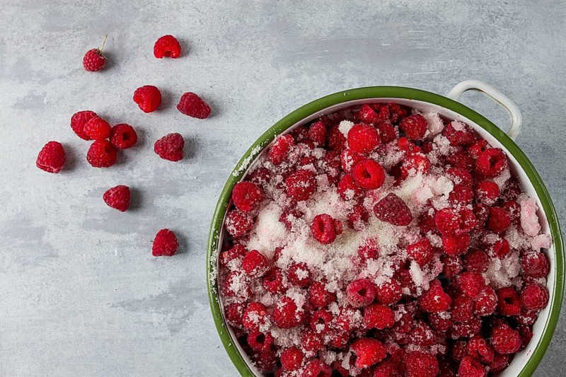 Fresh raspberry berry, covered with granulated sugar, jam preparation, top view, no people