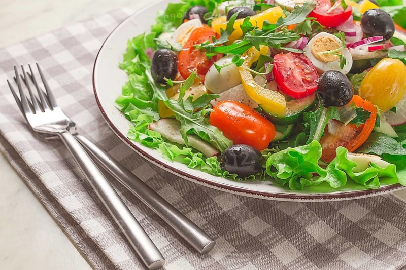 Vegetable salad, with quail eggs and olives, fresh, close-up, no people